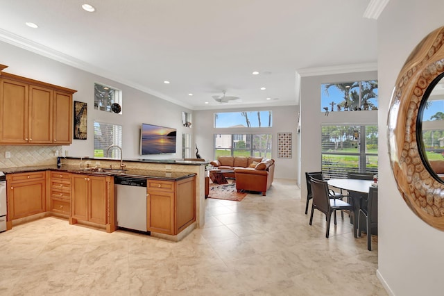 kitchen featuring a peninsula, a sink, decorative backsplash, dishwasher, and crown molding