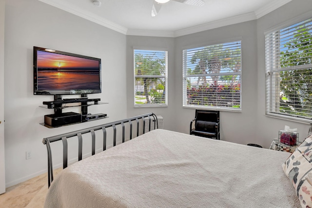 bedroom with ceiling fan, multiple windows, baseboards, and crown molding