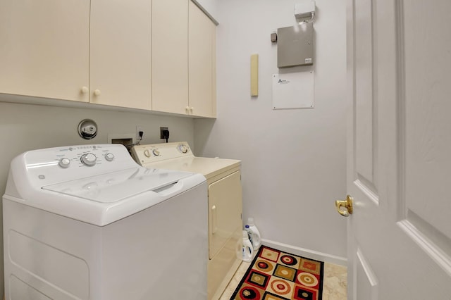 laundry room with cabinet space, washer and clothes dryer, baseboards, and light tile patterned flooring