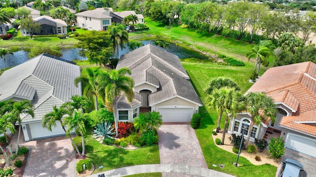 bird's eye view featuring a water view and a residential view