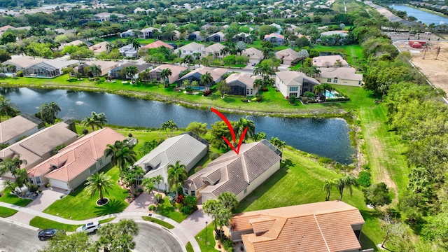 birds eye view of property with a residential view and a water view