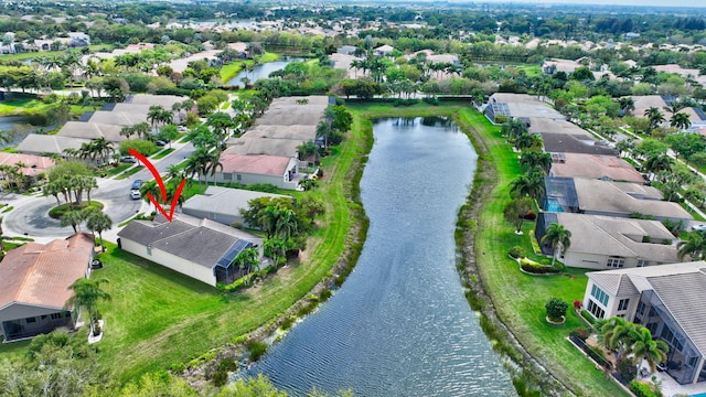 bird's eye view featuring a water view and a residential view