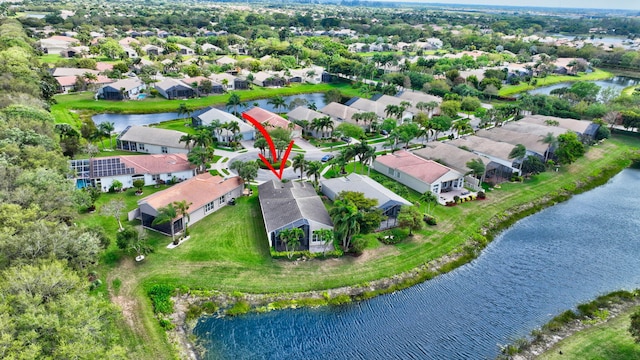 aerial view with a residential view and a water view