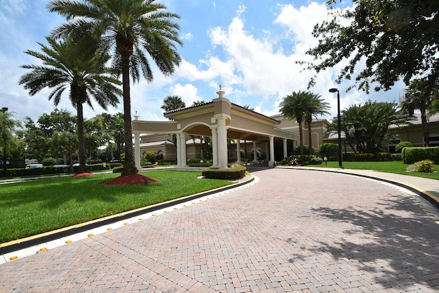 view of property featuring decorative driveway