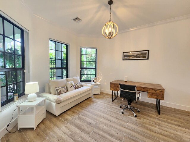 office space featuring light wood-type flooring, visible vents, and crown molding