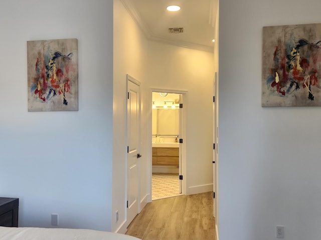 hall featuring ornamental molding, wood finished floors, visible vents, and recessed lighting