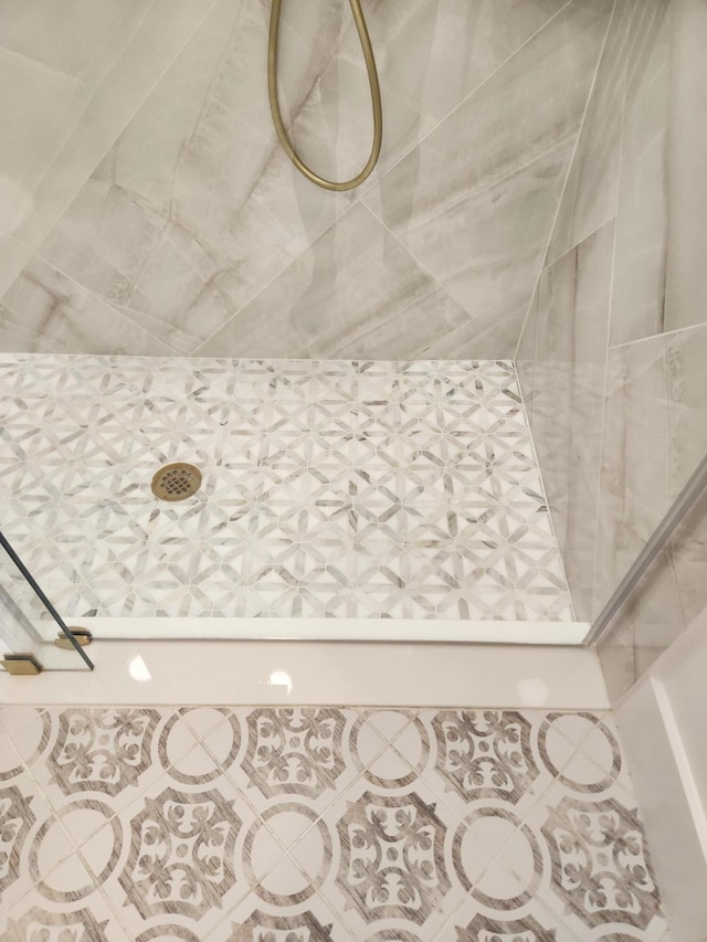 full bath featuring a tile shower