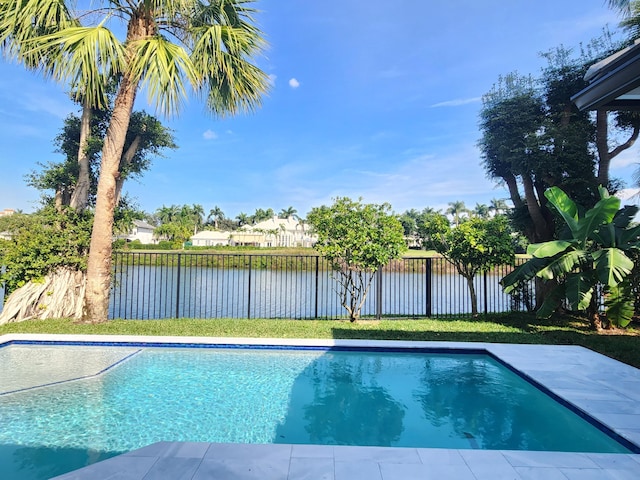 view of pool featuring a fenced in pool, a fenced backyard, and a water view