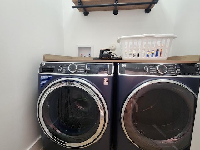 laundry area featuring laundry area and washer and clothes dryer