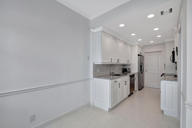 kitchen featuring visible vents, backsplash, appliances with stainless steel finishes, ornamental molding, and a sink