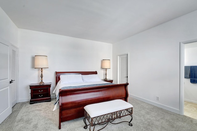 bedroom with carpet and baseboards