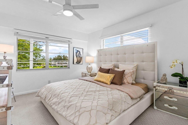 bedroom with carpet flooring, ceiling fan, and baseboards