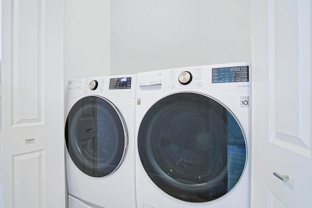 laundry area featuring laundry area and washing machine and dryer