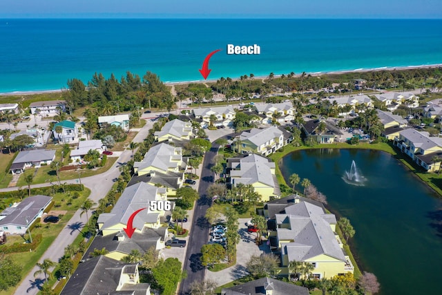 bird's eye view with a water view and a residential view