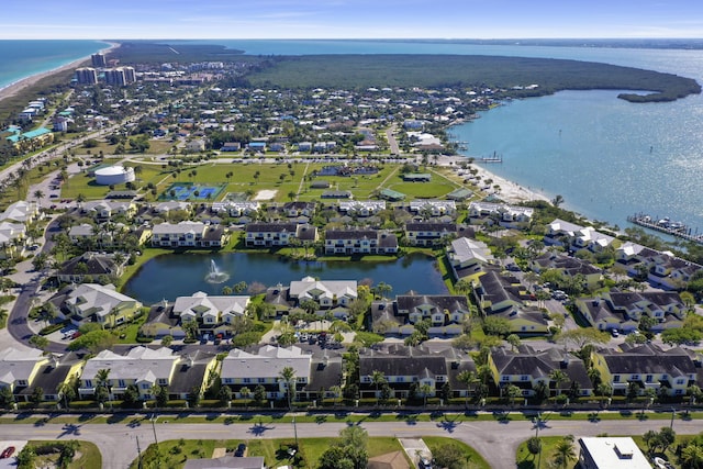 birds eye view of property with a residential view and a water view