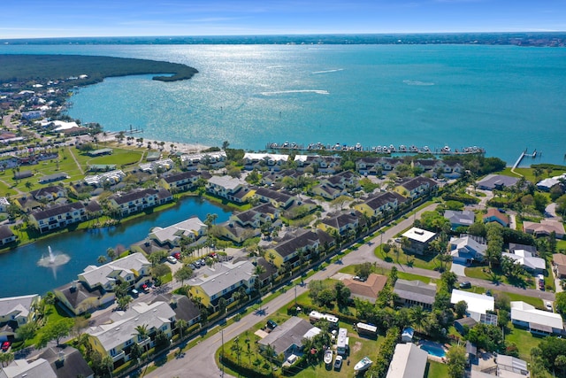 bird's eye view featuring a water view and a residential view