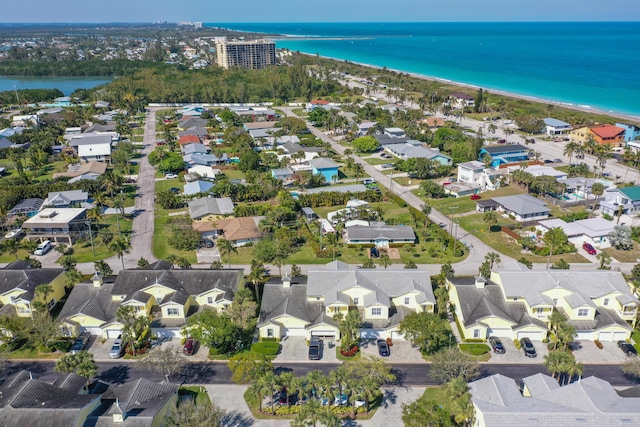 bird's eye view featuring a residential view, a water view, and a beach view