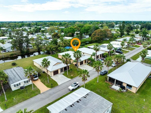 aerial view with a water view and a residential view