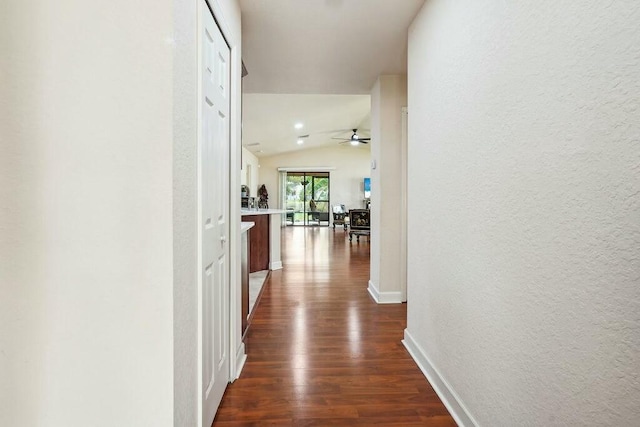 kitchen featuring washer / dryer, backsplash, appliances with stainless steel finishes, and reddish brown cabinets