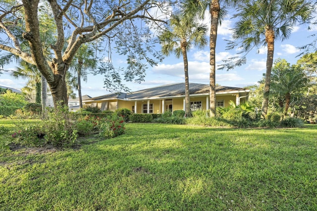 exterior space featuring a lawn and stucco siding