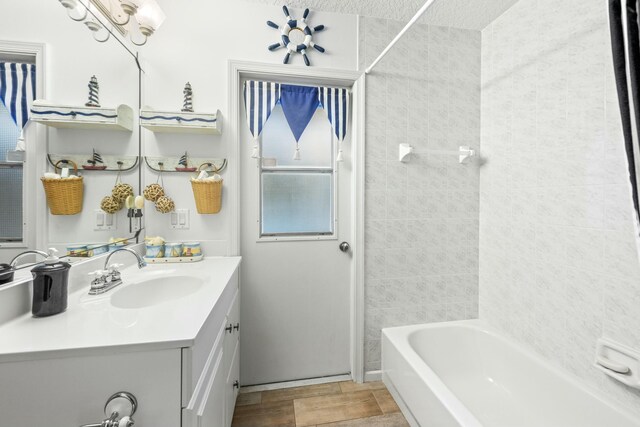 bathroom with shower / bathtub combination with curtain, vanity, and toilet