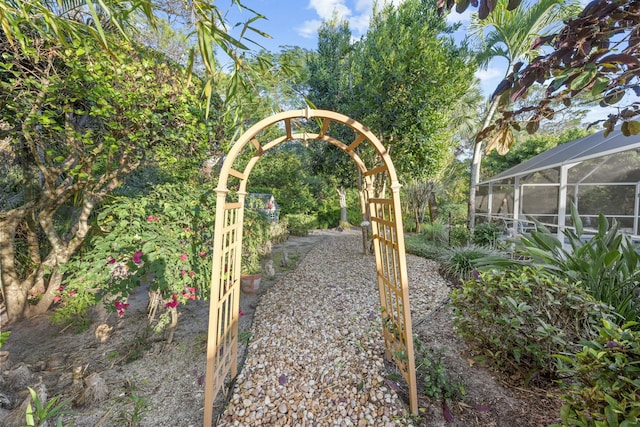 view of yard featuring glass enclosure