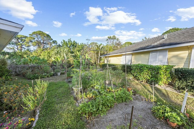 ranch-style home with a garage, concrete driveway, and a front yard