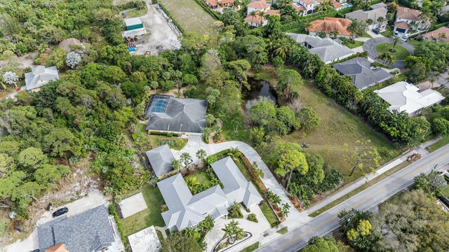 bird's eye view with a residential view and a water view