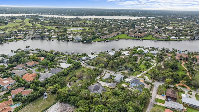 drone / aerial view featuring a residential view and a water view