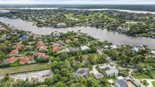 birds eye view of property featuring a residential view and a water view