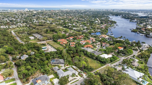 bird's eye view featuring a residential view and a water view