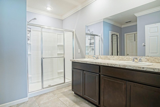 bathroom with crown molding, visible vents, a sink, and a shower stall