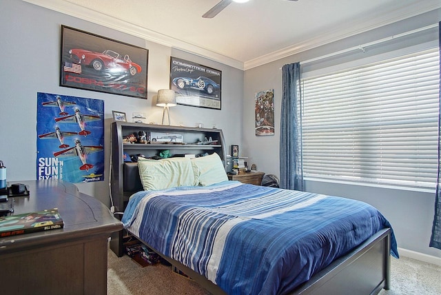 bedroom with a ceiling fan, carpet, crown molding, and baseboards