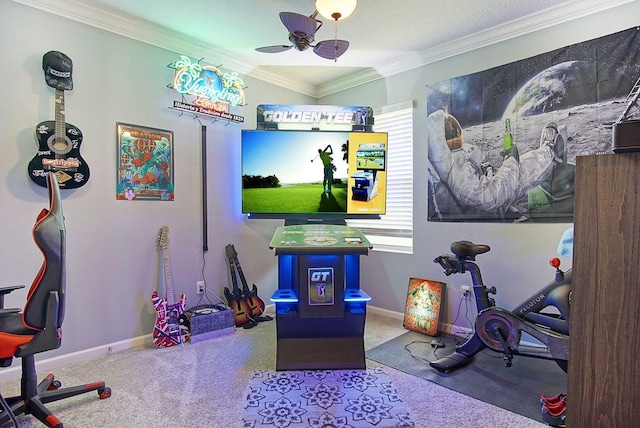 recreation room featuring baseboards, carpet floors, ceiling fan, and crown molding