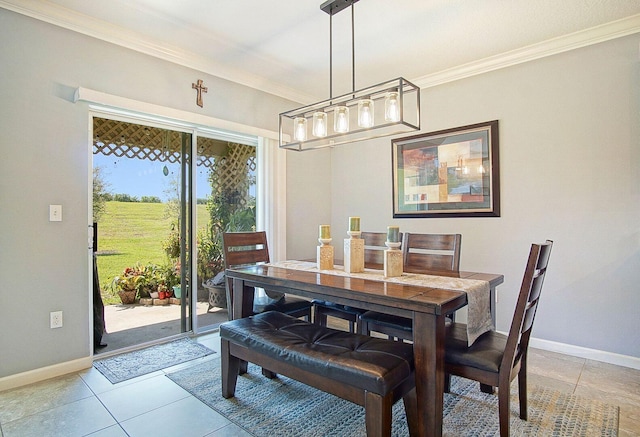 dining room with ornamental molding, baseboards, and light tile patterned floors