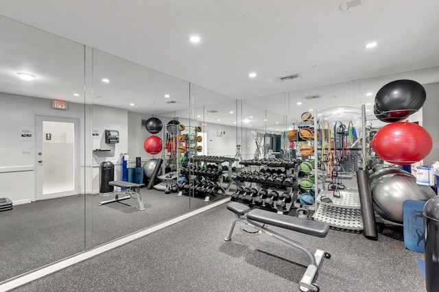 exercise room featuring recessed lighting and visible vents