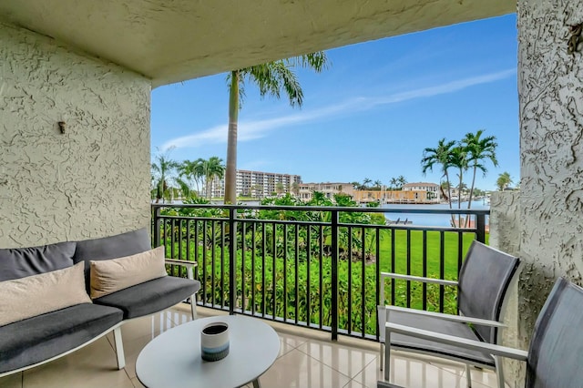 balcony featuring a water view