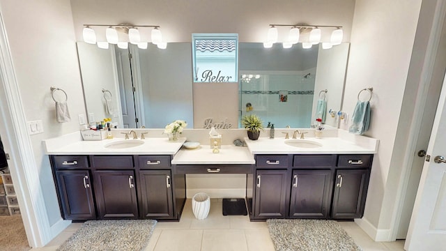 9592 SW Royal Poinciana Dr, Port Saint Lucie, FL 34987 - bathroom with a tile shower, vanity, baseboards, and tile patterned floors