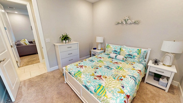 9592 SW Royal Poinciana Dr, Port Saint Lucie, FL 34987 - bedroom with light carpet, baseboards, and visible vents