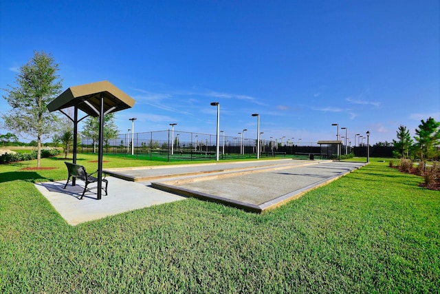 9592 SW Royal Poinciana Dr, Port Saint Lucie, FL 34987 - view of property's community with a lawn and fence