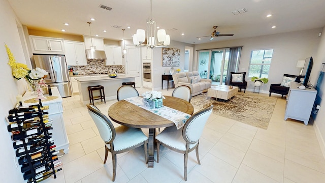 9592 SW Royal Poinciana Dr, Port Saint Lucie, FL 34987 - dining area featuring baseboards, light tile patterned flooring, visible vents, and recessed lighting