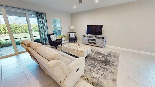 9592 SW Royal Poinciana Dr, Port Saint Lucie, FL 34987 - living area with a ceiling fan, recessed lighting, light tile patterned flooring, and baseboards