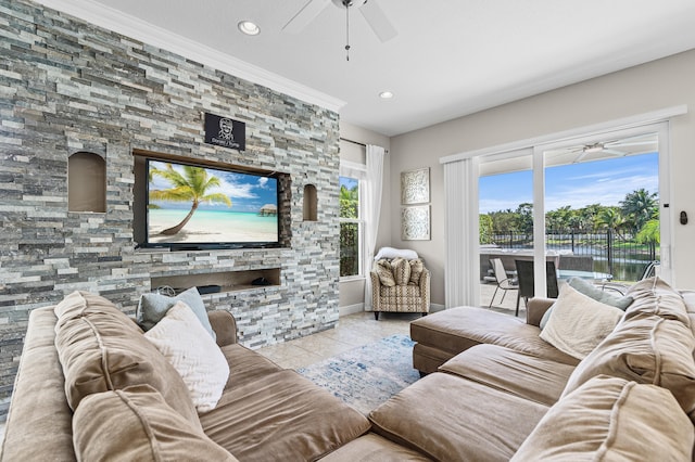 living room featuring ceiling fan, ornamental molding, recessed lighting, and tile patterned floors