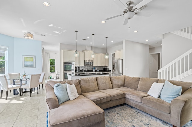 living room featuring light tile patterned floors, stairway, visible vents, and recessed lighting