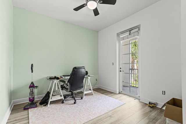 home office with ceiling fan, baseboards, and wood finished floors