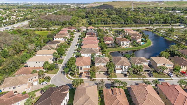 birds eye view of property featuring a residential view and a water view