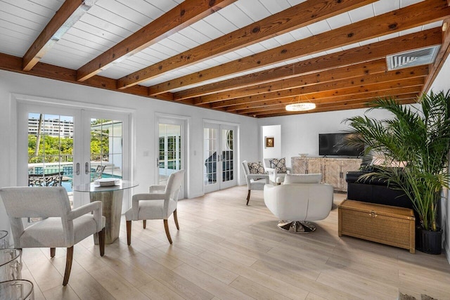 interior space featuring wood ceiling, french doors, beamed ceiling, and visible vents