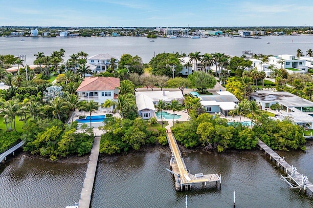 drone / aerial view with a water view and a residential view