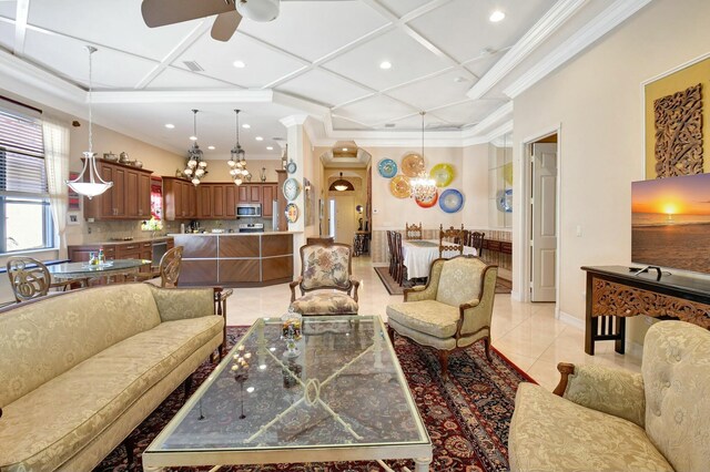 kitchen featuring light tile patterned floors, tasteful backsplash, appliances with stainless steel finishes, light stone countertops, and crown molding