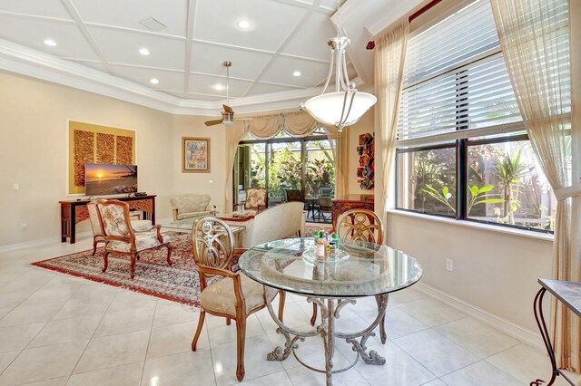 kitchen featuring light stone counters, backsplash, light tile patterned flooring, and stainless steel fridge